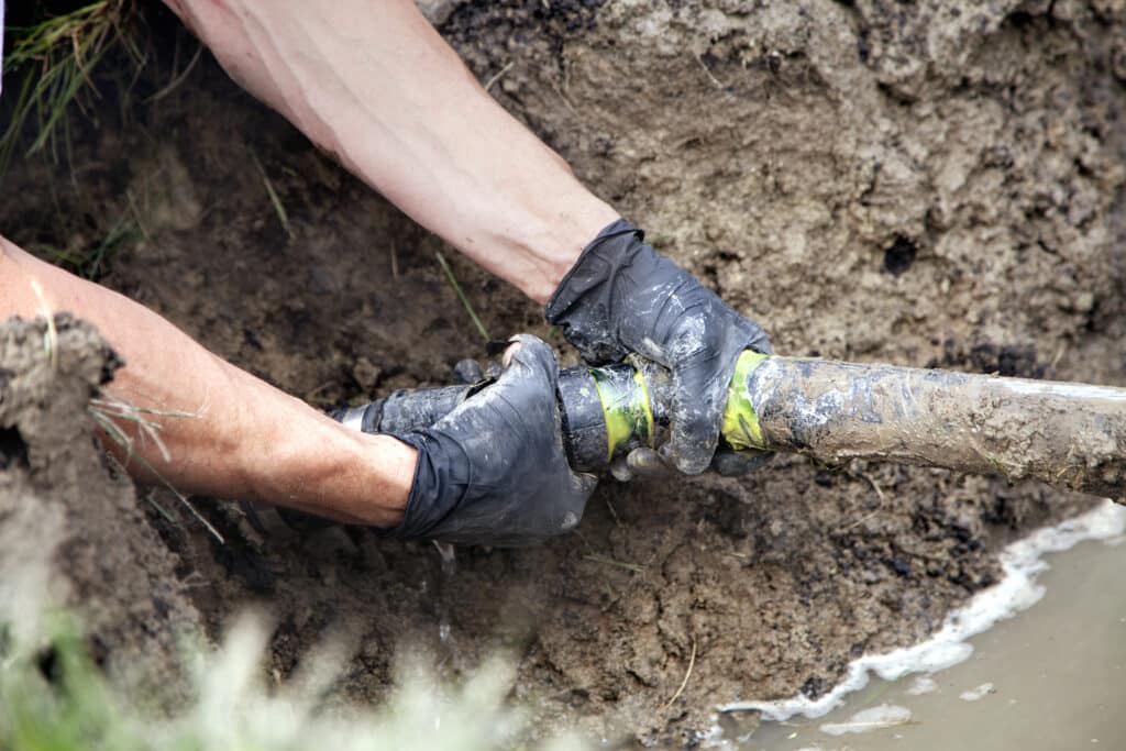 Plumber replacing part of a sewer line